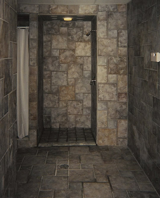 Residential bathroom with tile shower